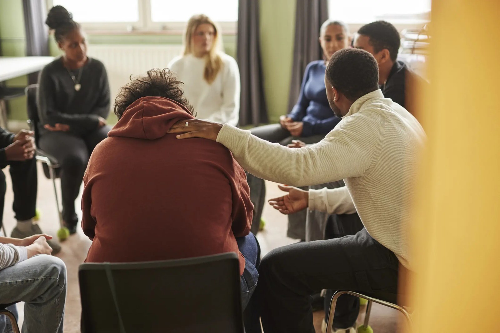 Adults in a group therapy discussion circle